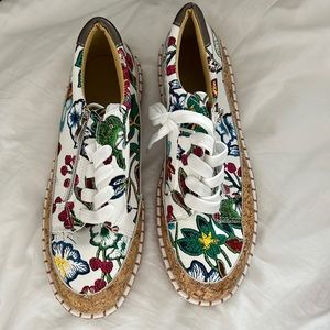 A stylish multi colored sneakers. They are brand new, never worn.